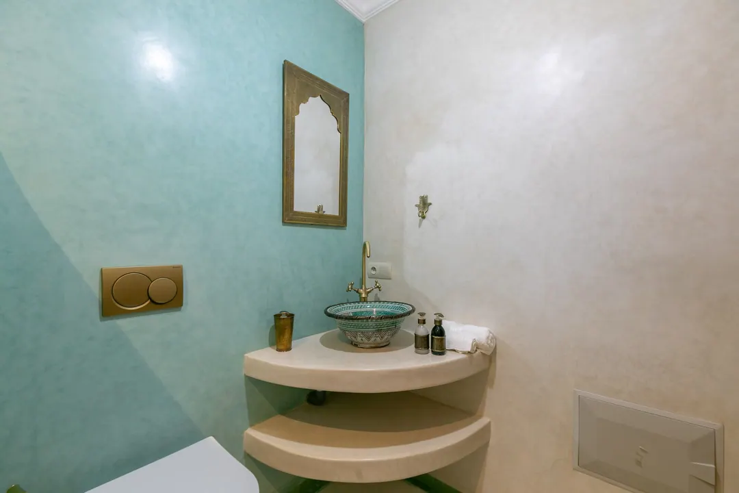 Jade room bathroom with a turquoise copper basin and tadelakt shower