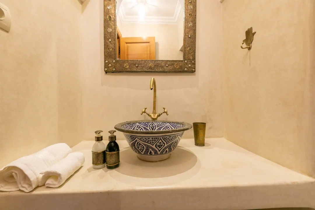 Ivory room bathroom with a blue-and-white Fez ceramic basin