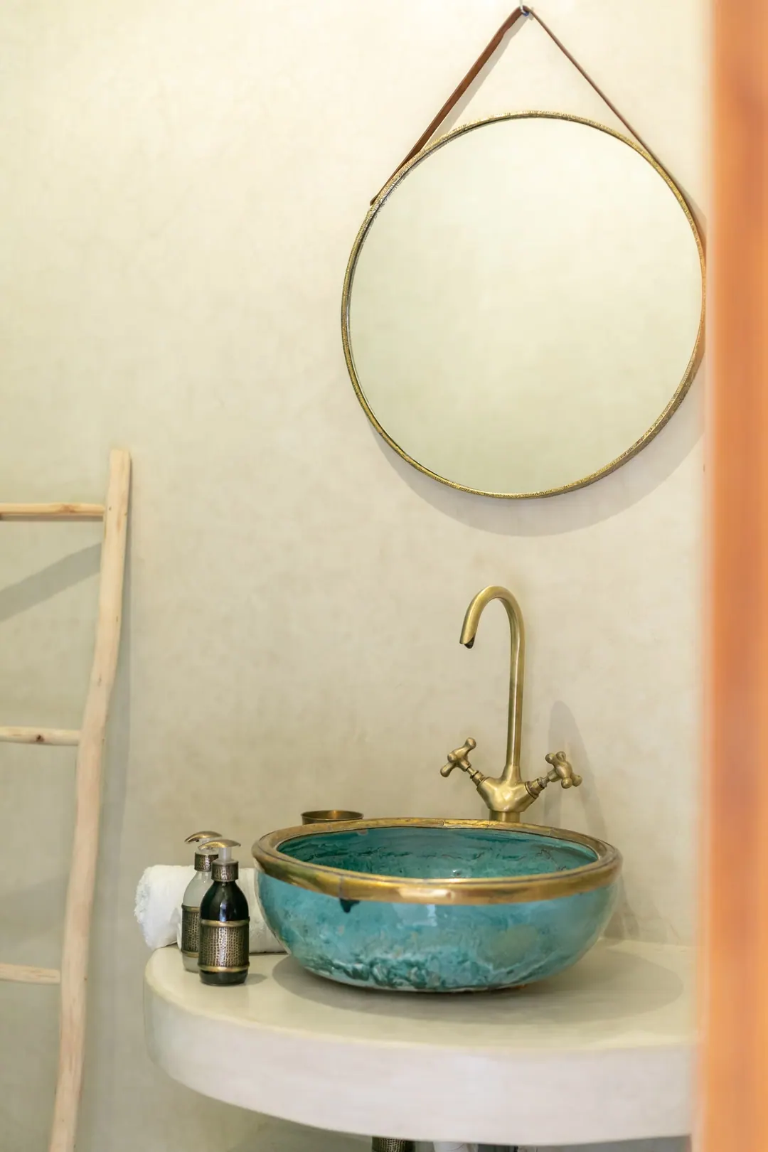 Turquoise room bathroom with a copper basin and blue mosaic shower