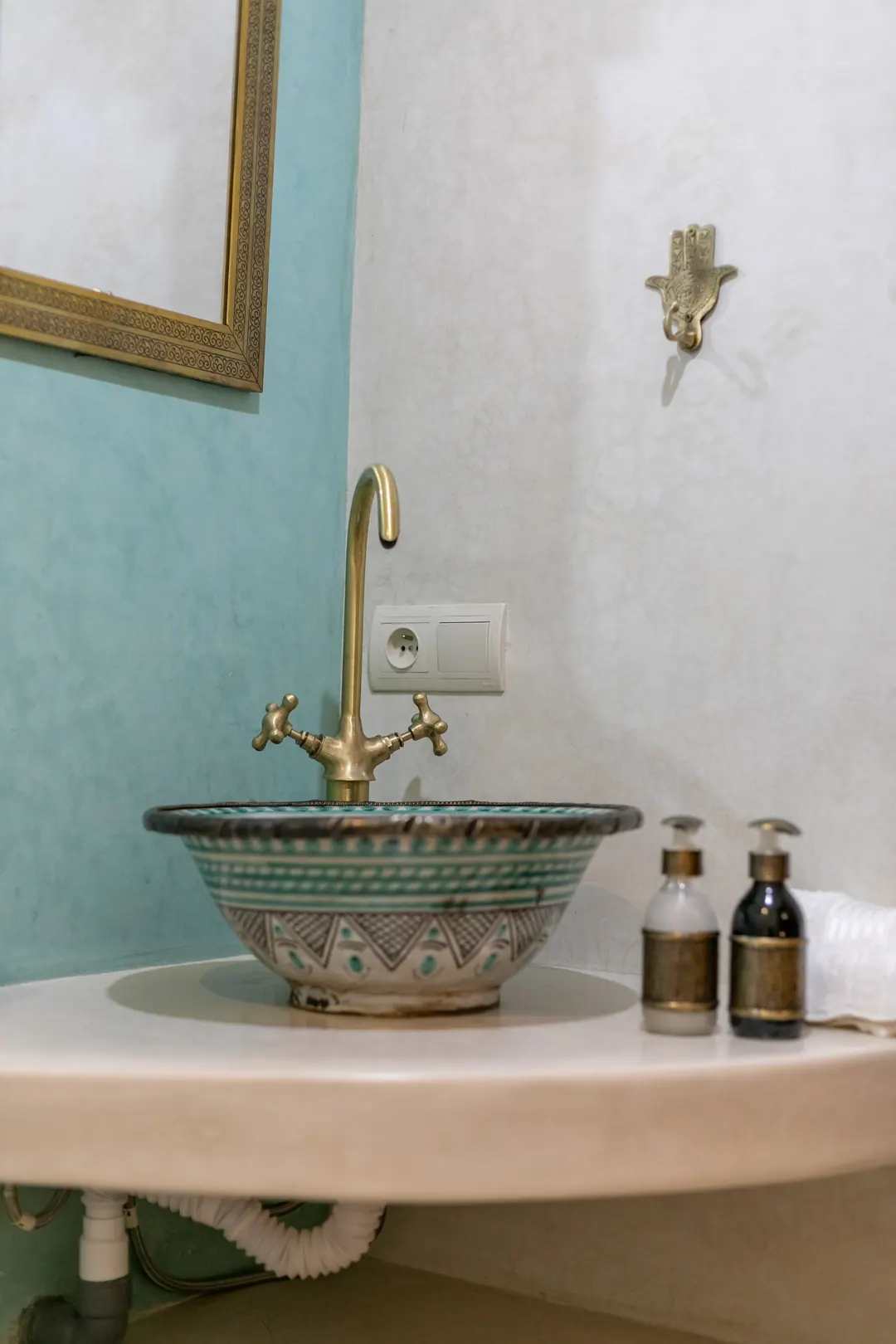 Jade room bathroom with a turquoise copper basin and tadelakt shower