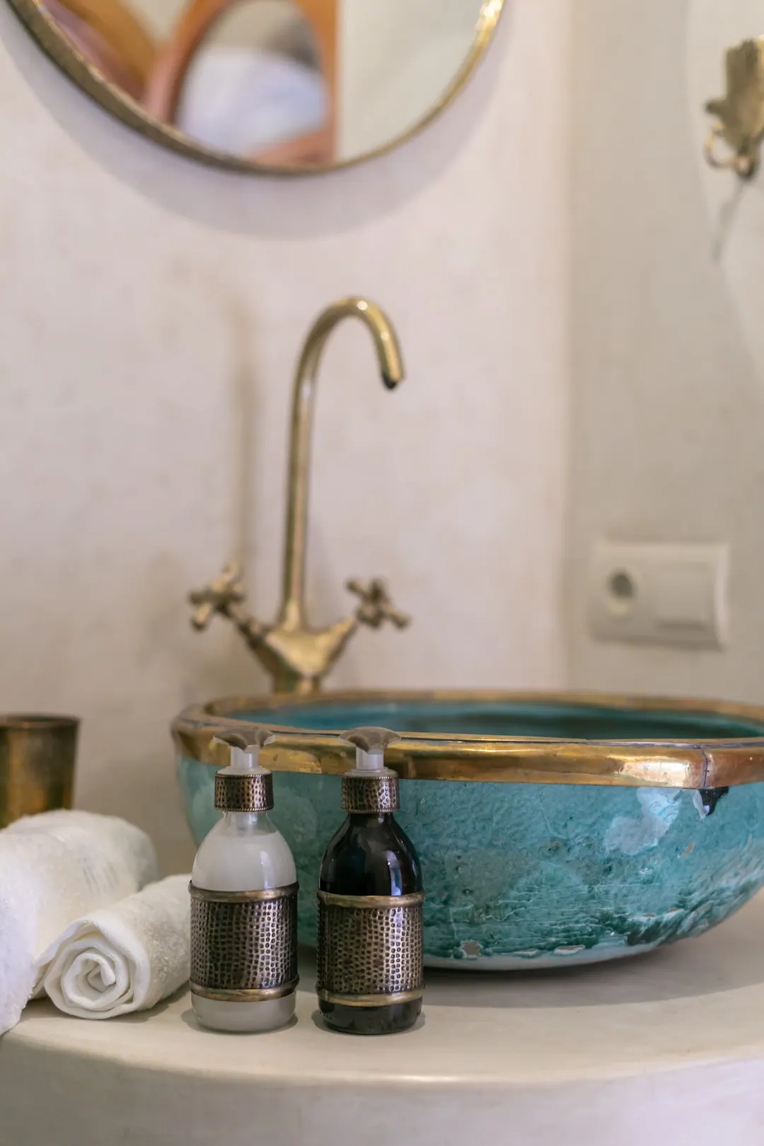 Turquoise room bathroom with a copper basin and blue mosaic shower