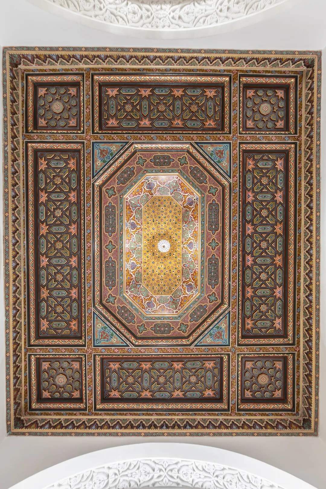 Painted cedar ceiling with geometric motifs