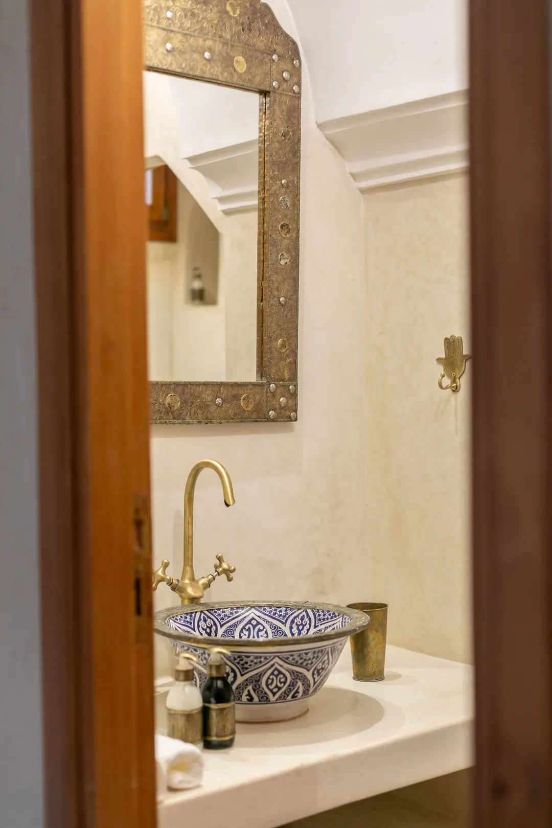 Ivory room bathroom with a blue-and-white Fez ceramic basin