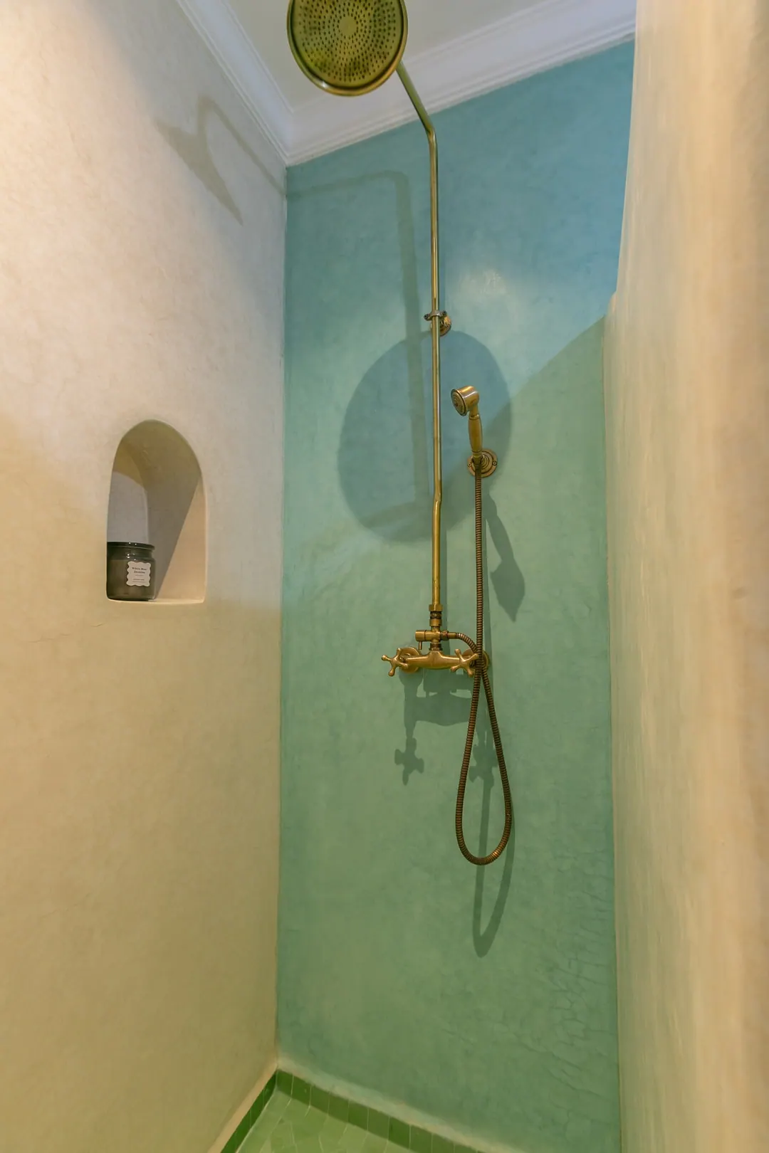 Jade room bathroom with a turquoise copper basin and tadelakt shower